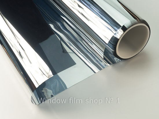 Roll of silver mirror window film partly unrolled