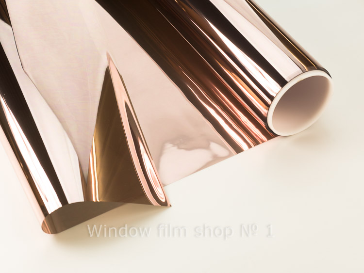 Bronze Ex 20 exterior mirror window film, bronze film partly unrolled from the roll