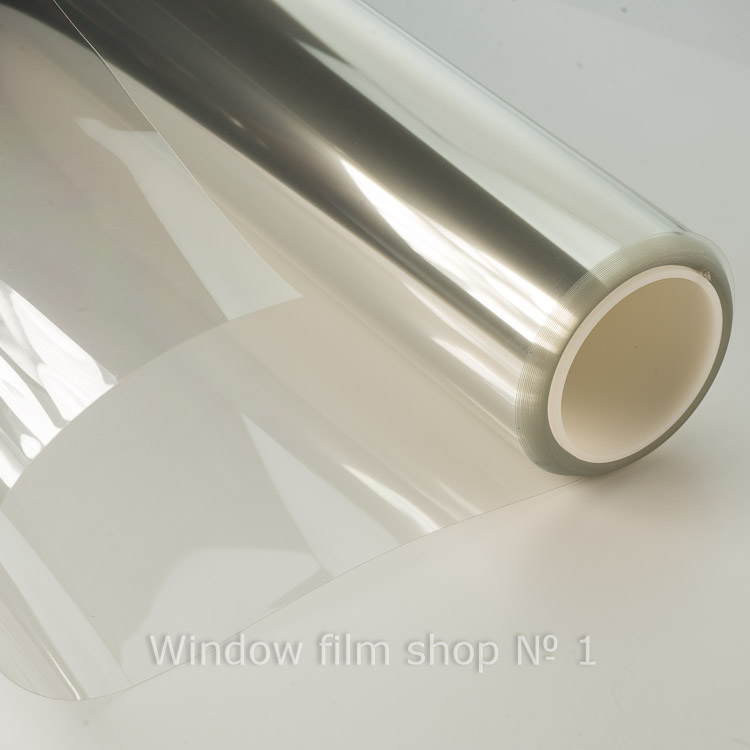 Roll of clear security window film, partly unrolled