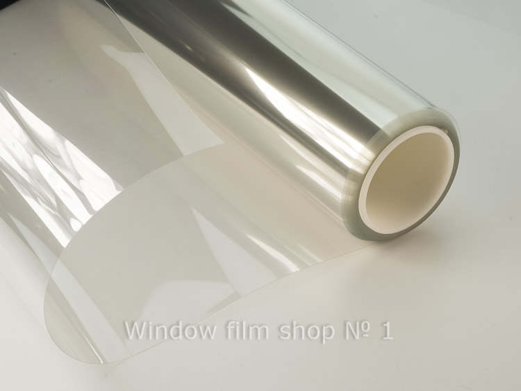 Roll of clear security window film Cristal 8 mil, partly unrolled