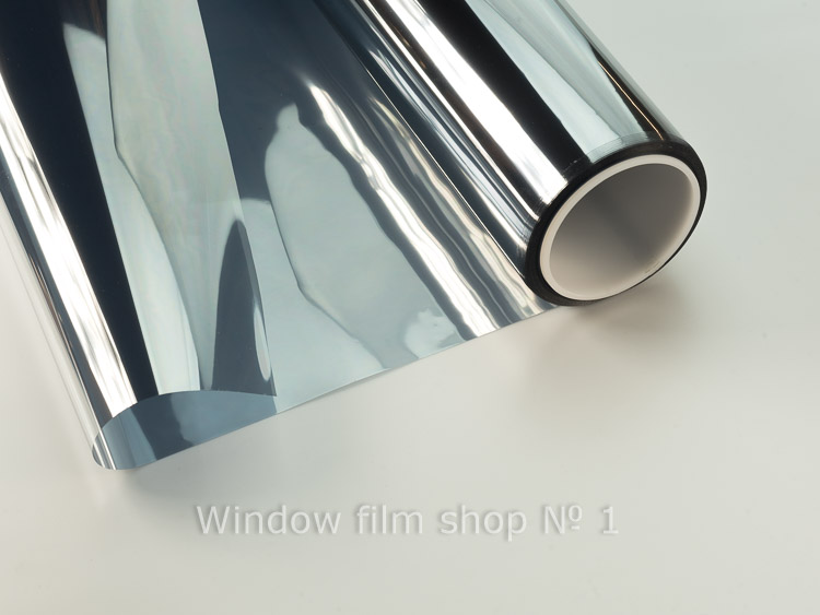 Roll of silver mirror window film Strata EX 35, partly unrolled